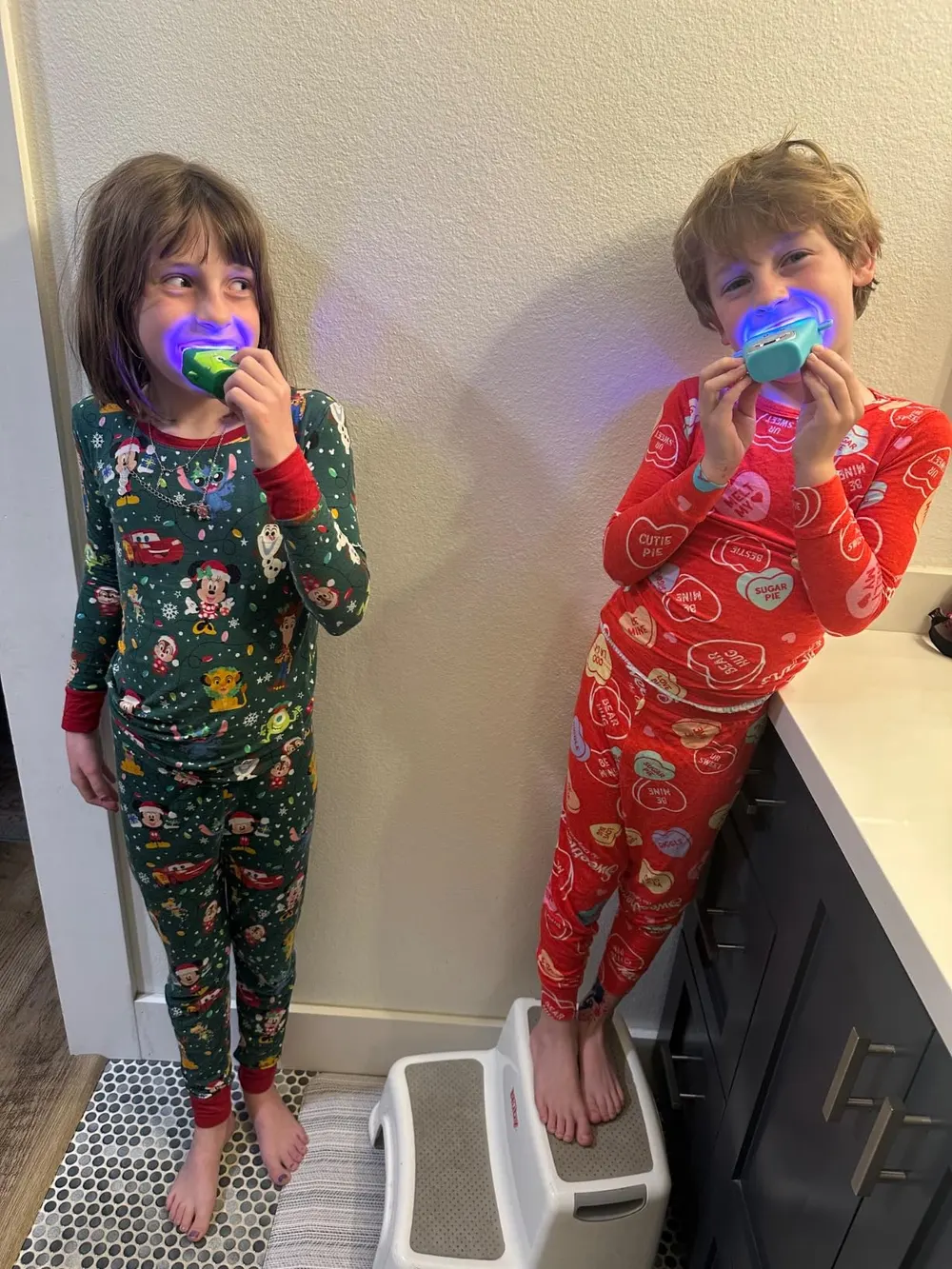 Child smiling while using the ChillDrift SmileWave Kids U-shaped toothbrush
